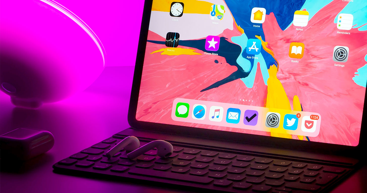 iPad and AirPods in a Tech Workspace iPad and AirPods in a Tech Workspace